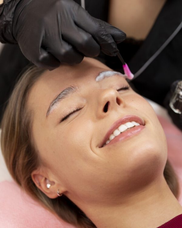 beautiful-young-woman-going-through-microblading-treatment